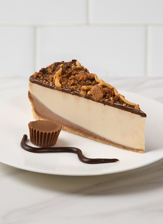A slice of Reese's® Peanut Butter Cheesecake