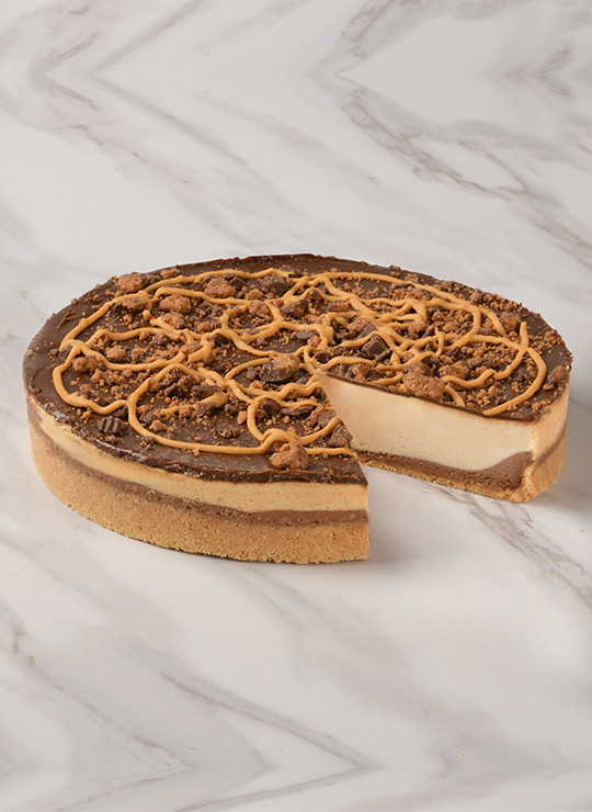 A slice of Reese's® Peanut Butter Cheesecake