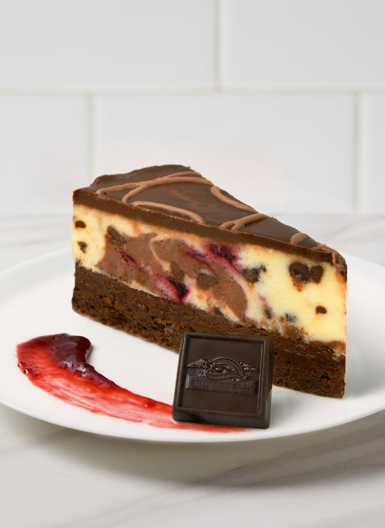 A slice of Chocolate Raspberry Cheesecake made with Ghirardelli®