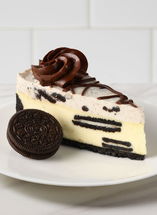 A slice of the Oreo Cookies and Cream Cheesecake